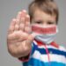 Young child wearing a respiratory mask as a prevention against the deadly Coronavirus Covid-19