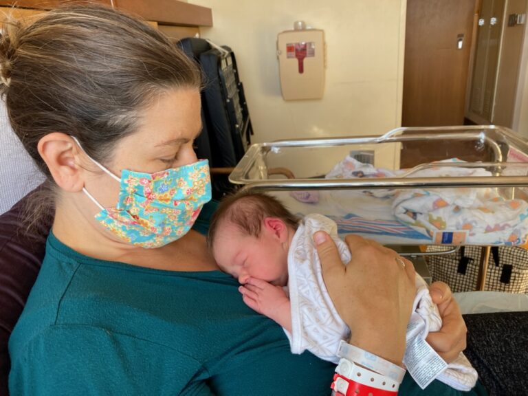 lady-holding-baby-mask-01